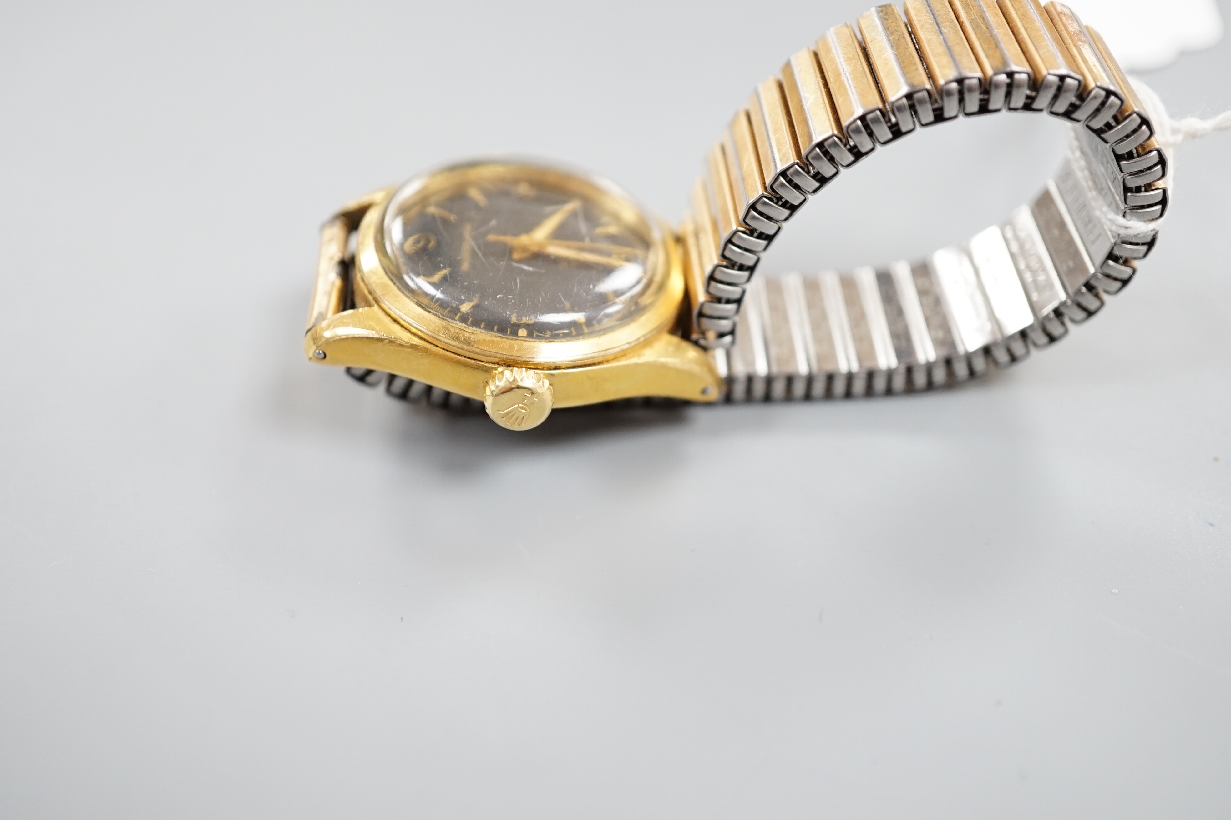 A gentleman's 1950's? mid-size steel and gold plated Tudor Oyster manual wind wrist watch, with black dial and associated strap, case diameter 33mm, no box or papers.